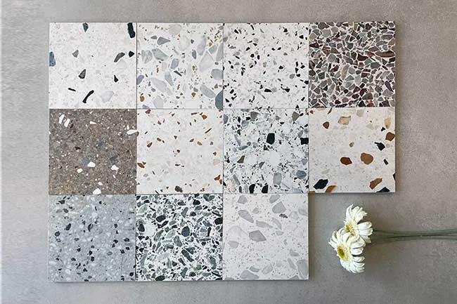 Overzicht van de 11 verschillende kleuren van de Revoir Paris Re-Bel collectie, verkrijgbaar bij Top Tegel 04. Terrazzo vloertegels in warme en koele tinten, perfect voor moderne interieurs. Verkrijgbaar in 60×60 en 100×100 cm, geschikt voor vloer en wand.